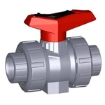 A plastic pipe with a red valve