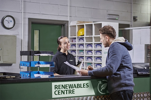 Two people at a Renewables Centre counter top