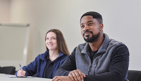 Two people sat at a table